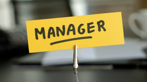 A yellow nametag that says "manager."